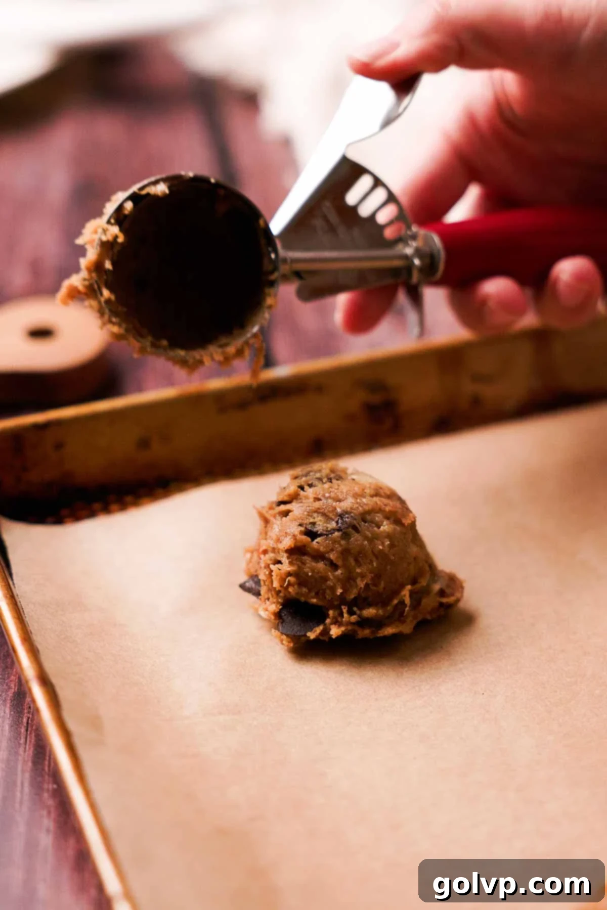 Soft-Baked Banana Bread Cookies 10 scooping banana bread cookie dough onto parchment paper sheet
