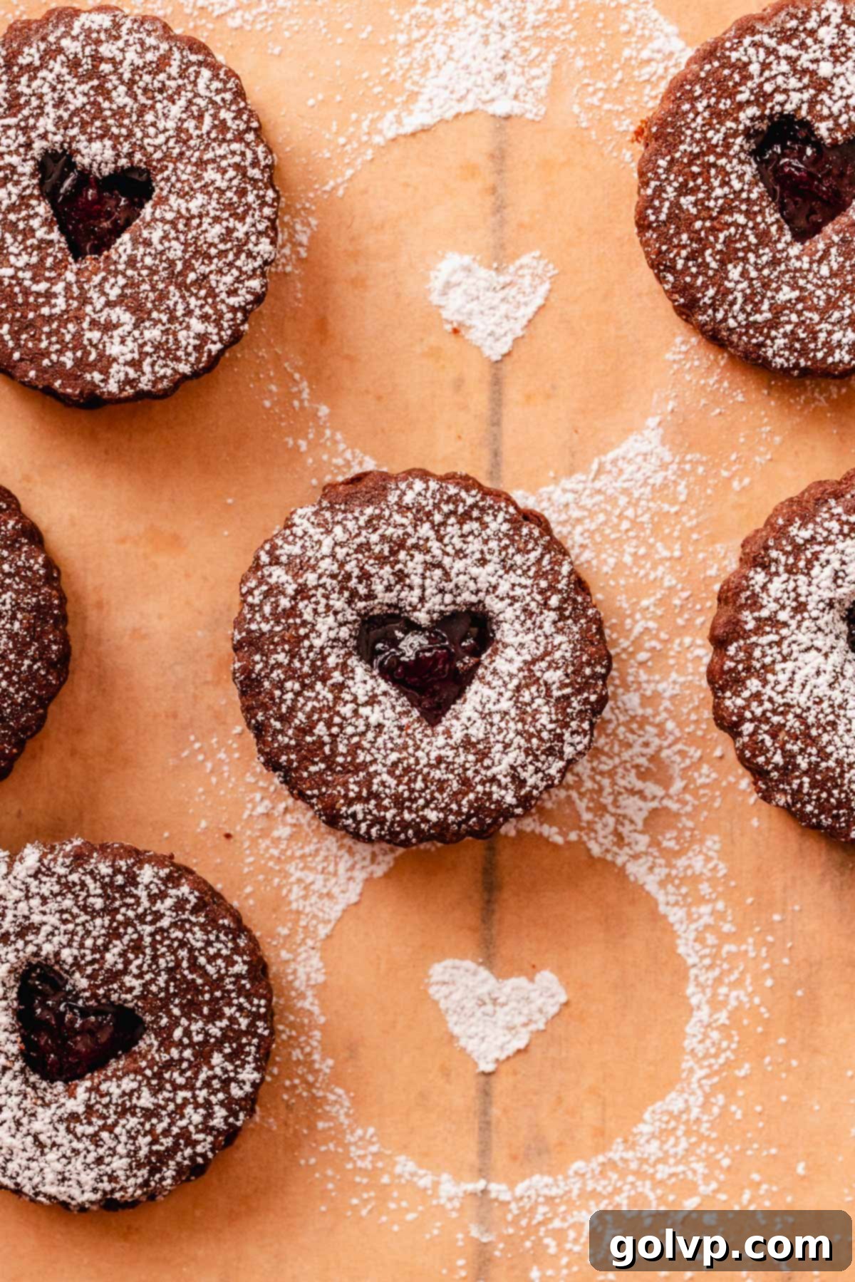 chocolate almond linzer cookies with cherry jam filling