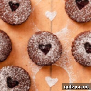 chocolate almond linzer cookies with cherry jam filling
