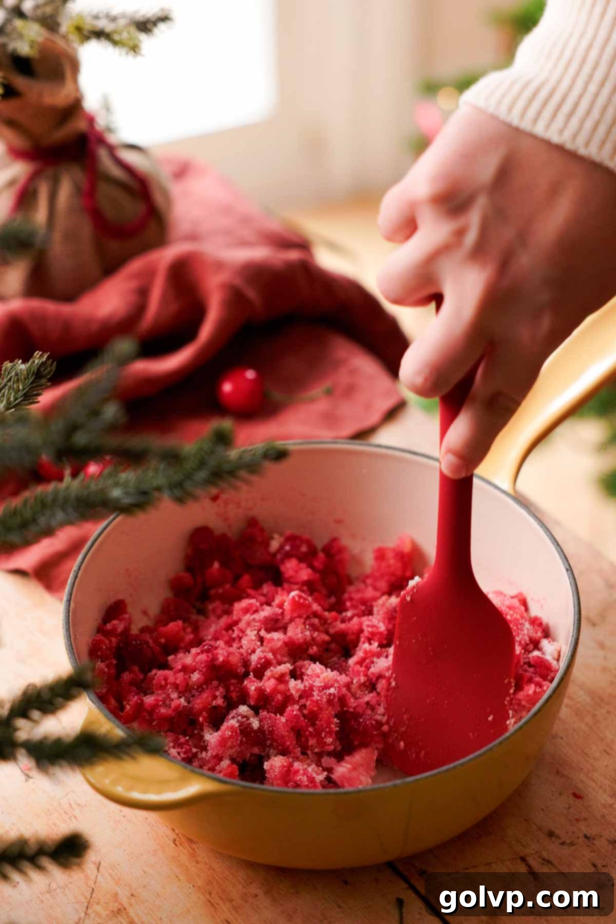 mixing tart cherry jam ingredients in saucepan