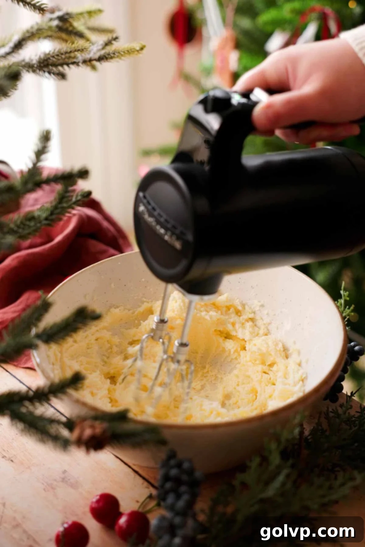 beating sugar and butter with an electric mixer