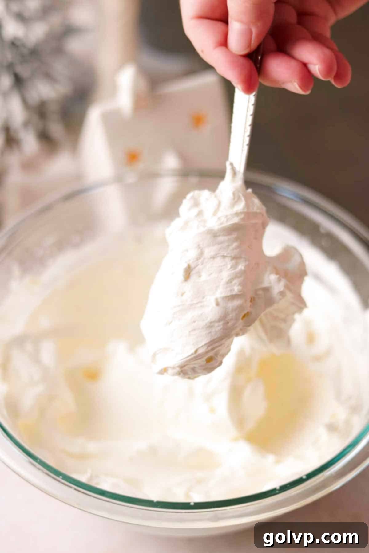 Thick and creamy whipped cream blended with mascarpone cheese, forming a mousse-like filling.