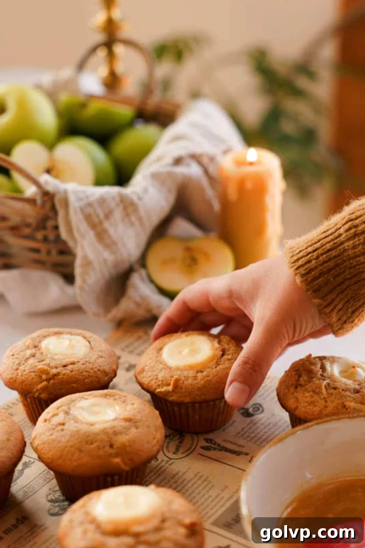 Baked apple cider muffins fresh out of the oven, before cinnamon sugar coating