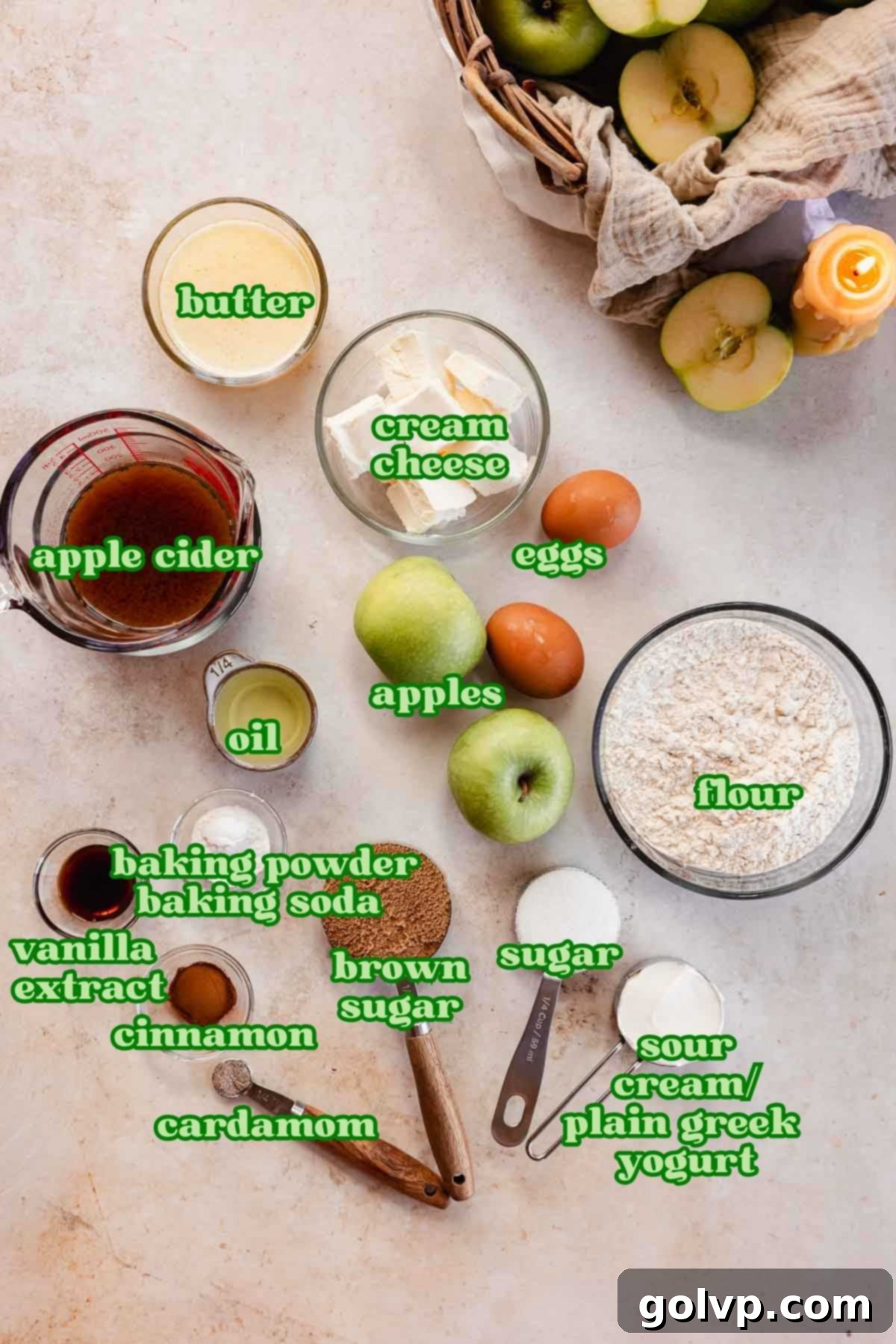 Individual bowls of ingredients for apple cider muffins including shredded apple, flour, and spices