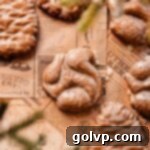 Holiday Cookie Delights 2024 4 squirrel shaped and glazed gingerbread cookie on parchment paper, a perfect holiday treat