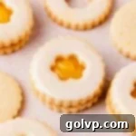 Holiday Cookie Delights 2024 6 lemon curd filled cut out lemon shortbread cookies shaped like flowers, a delightful treat
