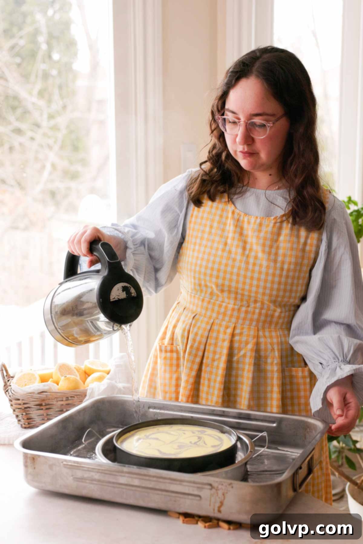 Lemon Poppy Seed Cheesecake Perfection 16 pouring water into water bath for cheesecake