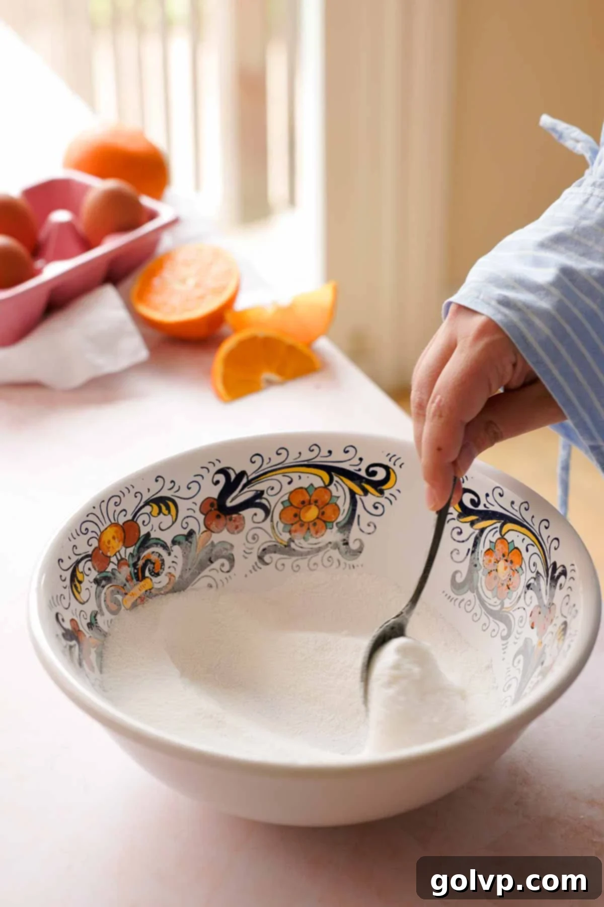 stirring sugar and cornstarch in a large bowl