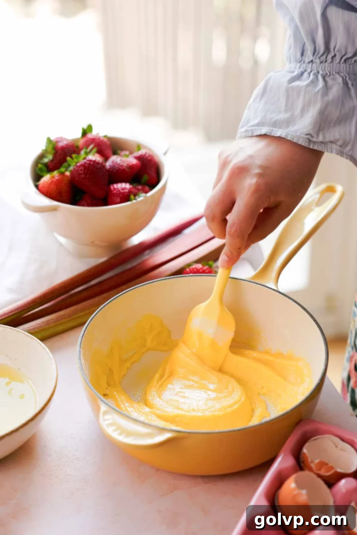 stirring sugar, egg yolks, and cornstarch together for custard