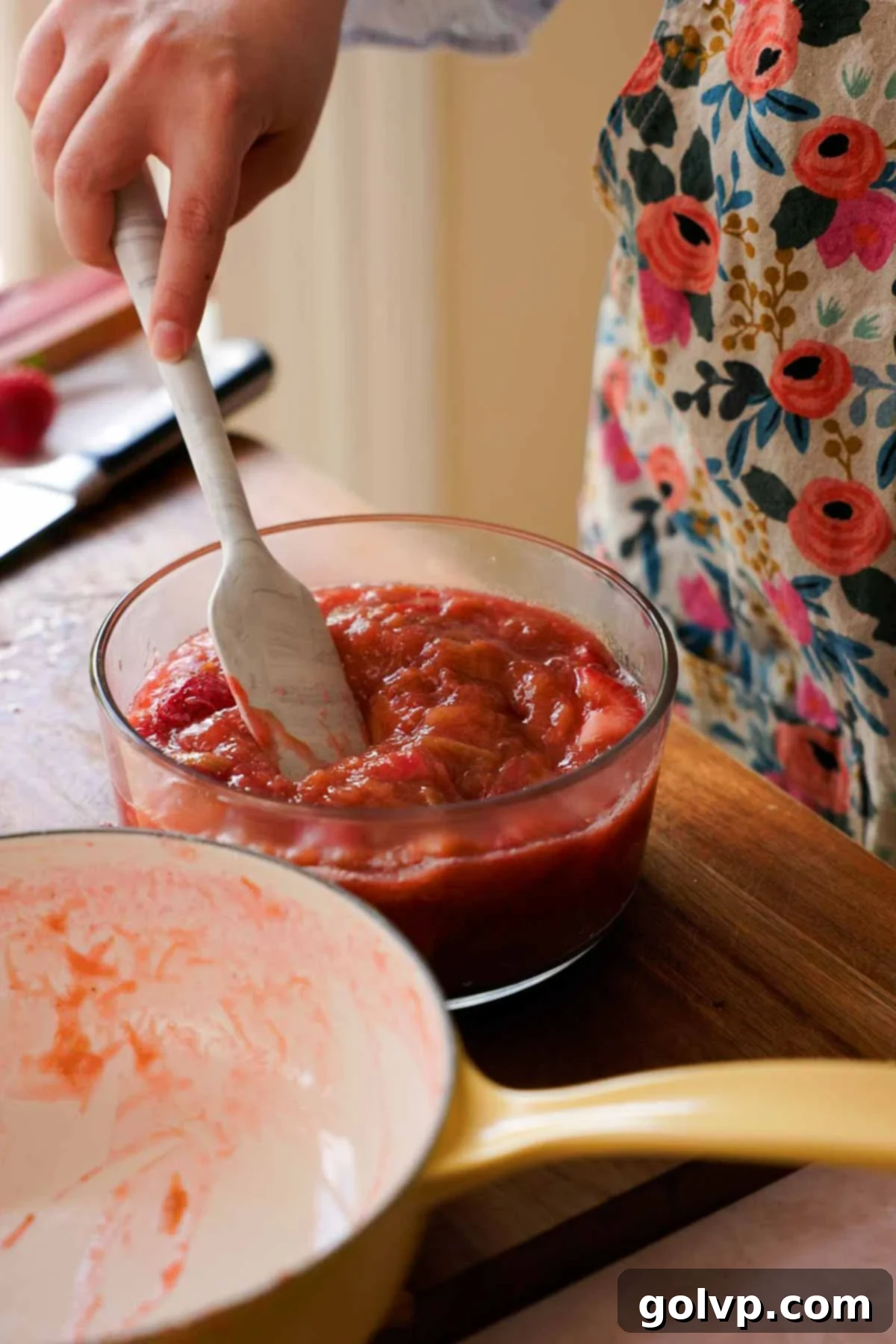 cooked rhubarb and fresh strawberry compote in glass container