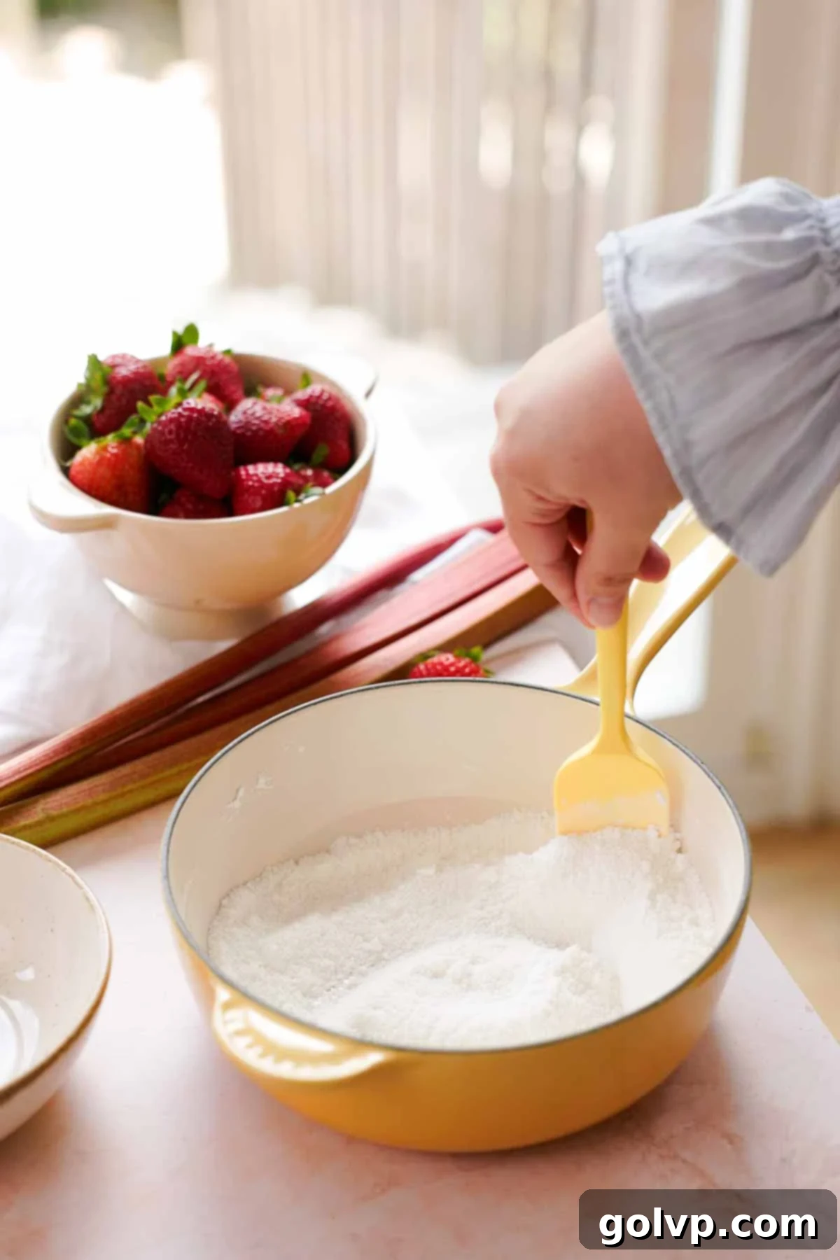 stirring sugar and cornstarch together in saucepan