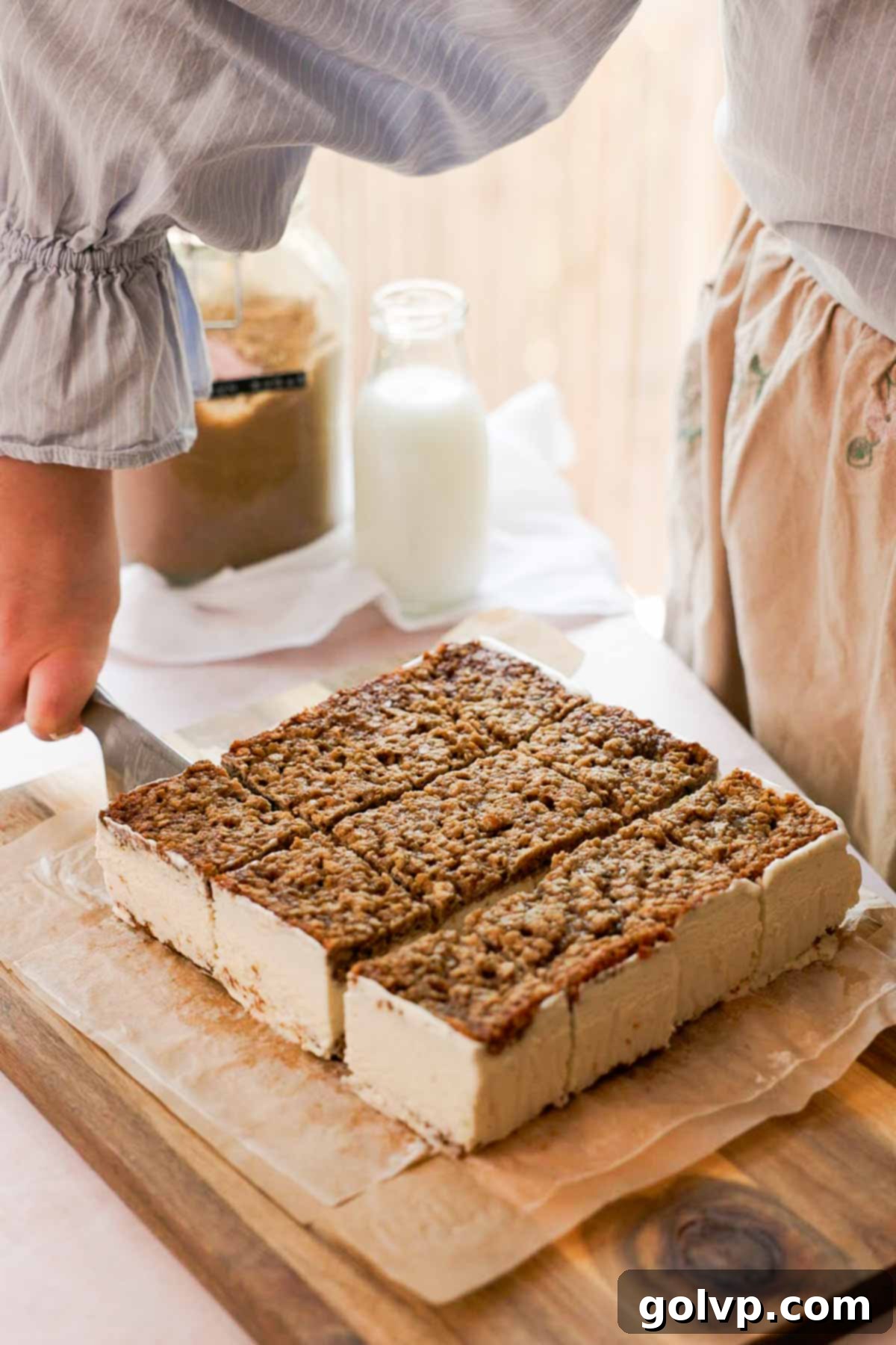 cutting oatmeal ice cream sandwich cookies into smaller rectangles with a knife