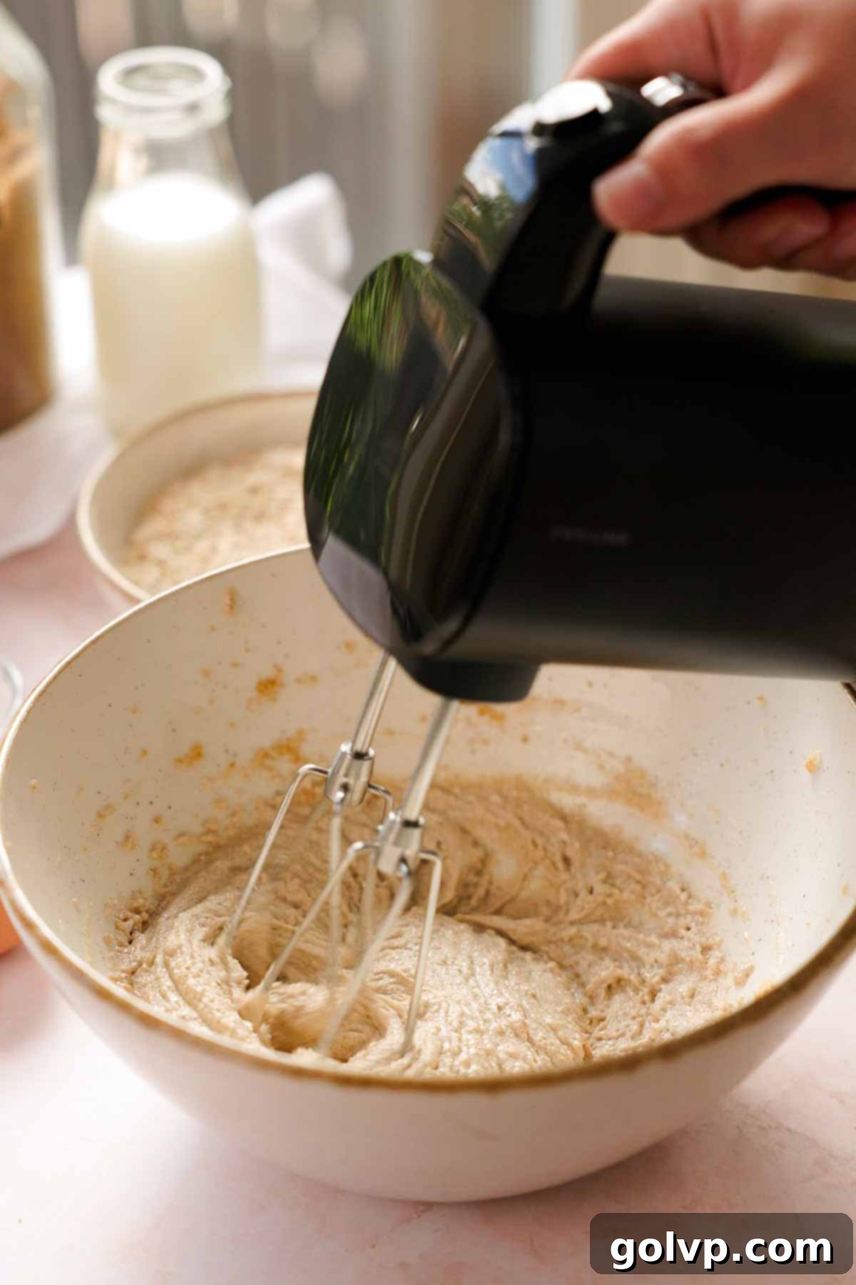 creaming butter, oil, and sugar in a bowl for oatmeal ice cream sandwiches