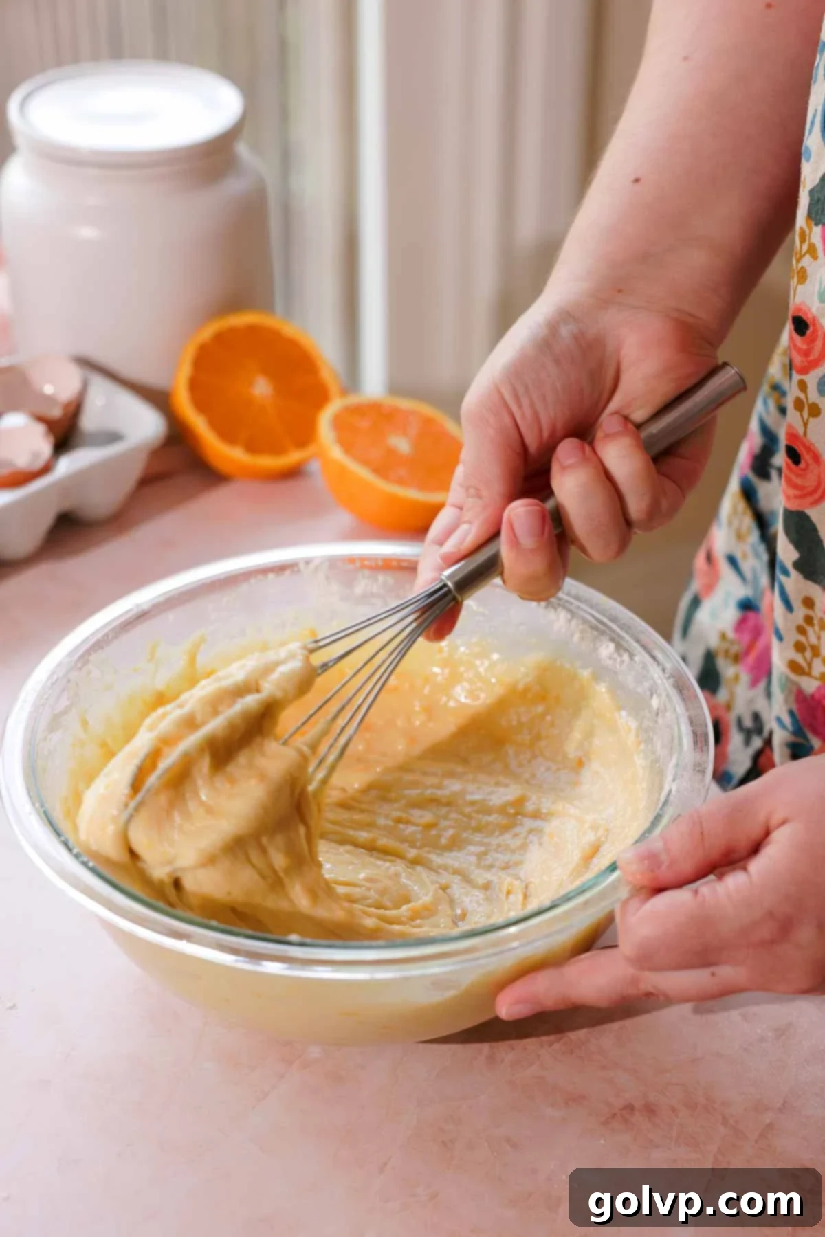 orange zest and rhubarb muffin batter in a glass bowl