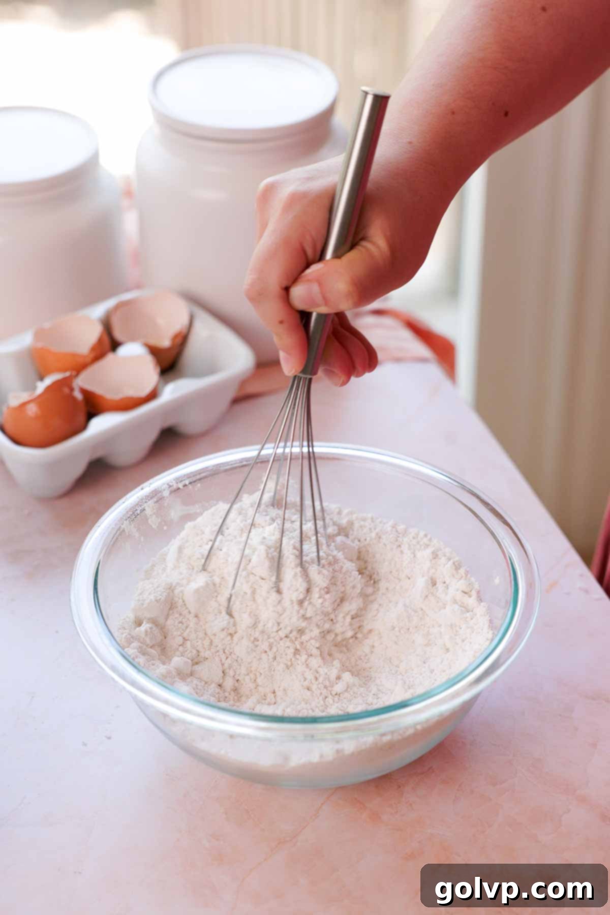 whisking dry ingredients together in a bowl