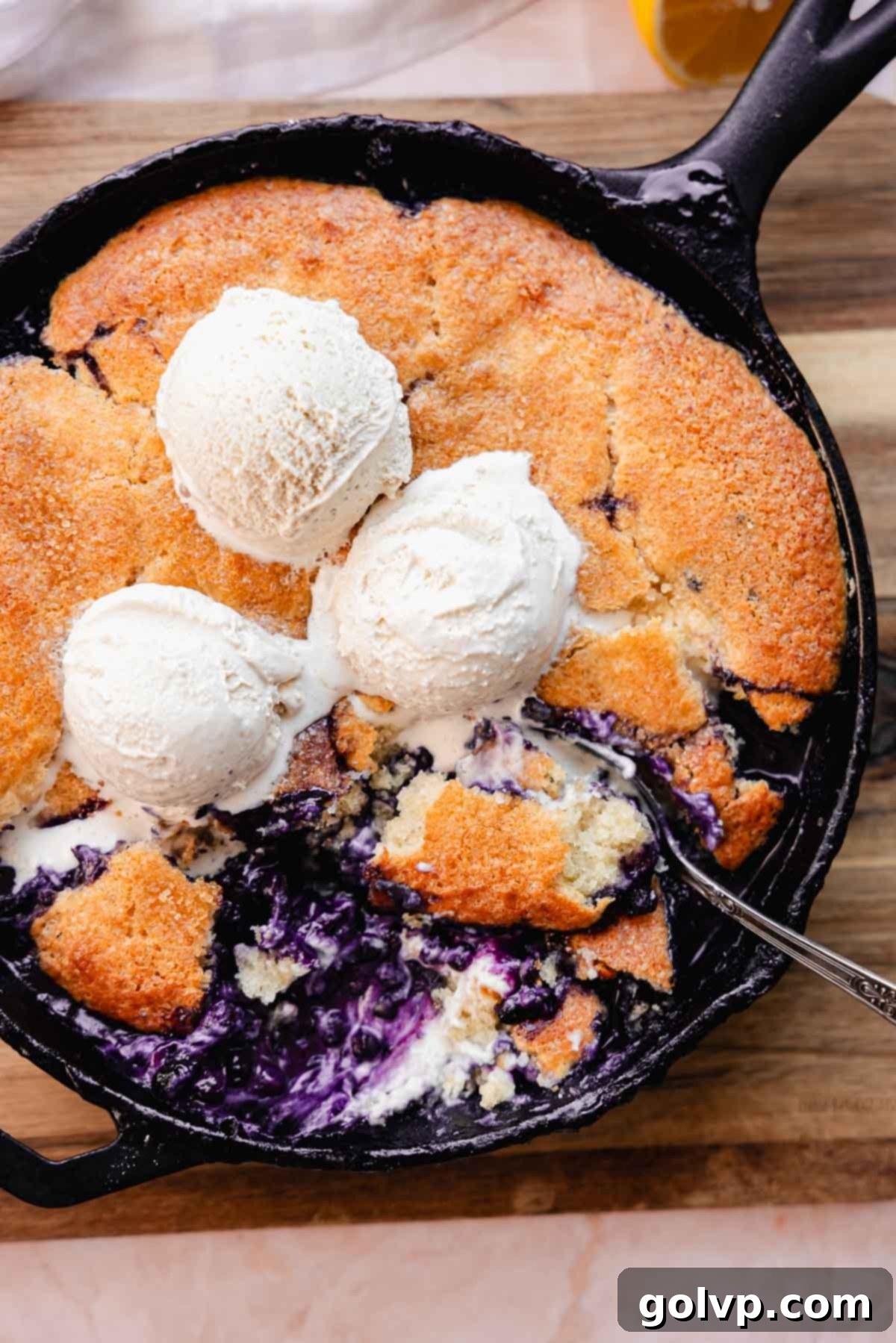 blueberry lemon cobbler with cream cheese and ice cream