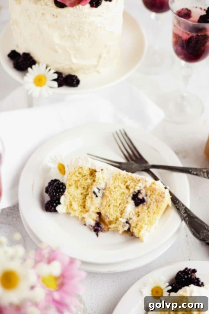 Salted Caramel Blackberry Cake on a pedestal