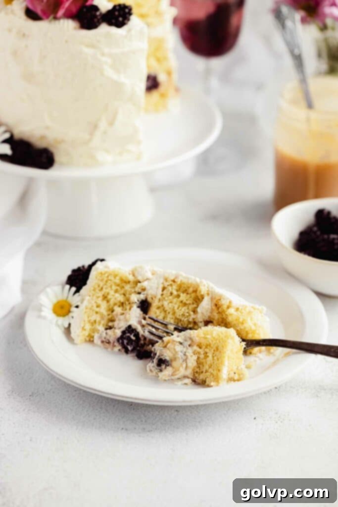 eating a slice of fluffy cake with blackberries and caramel