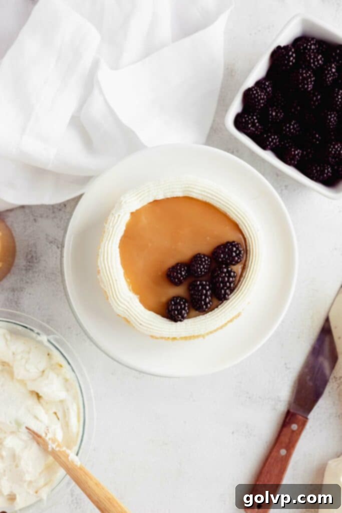 layering caramel and blackberries for the cake