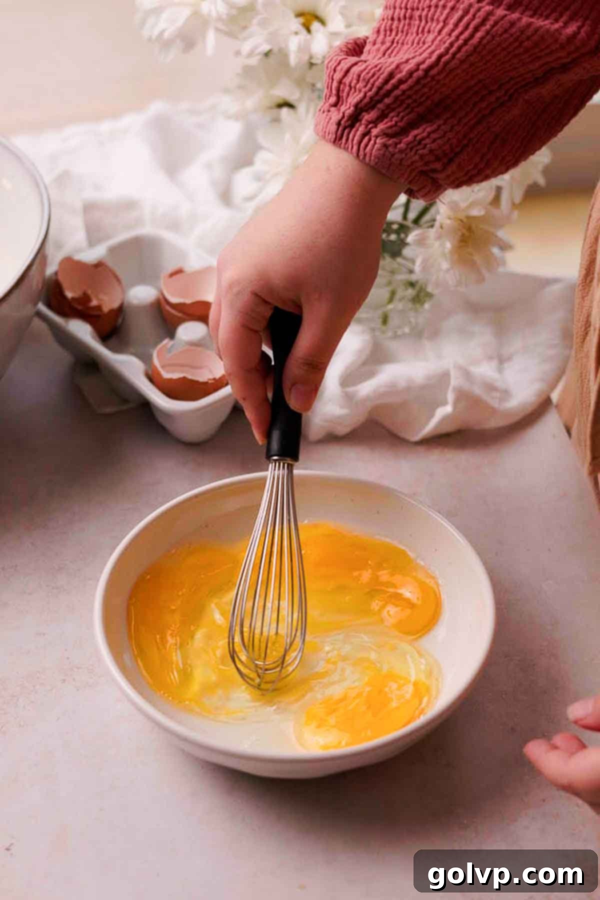 whisking eggs together