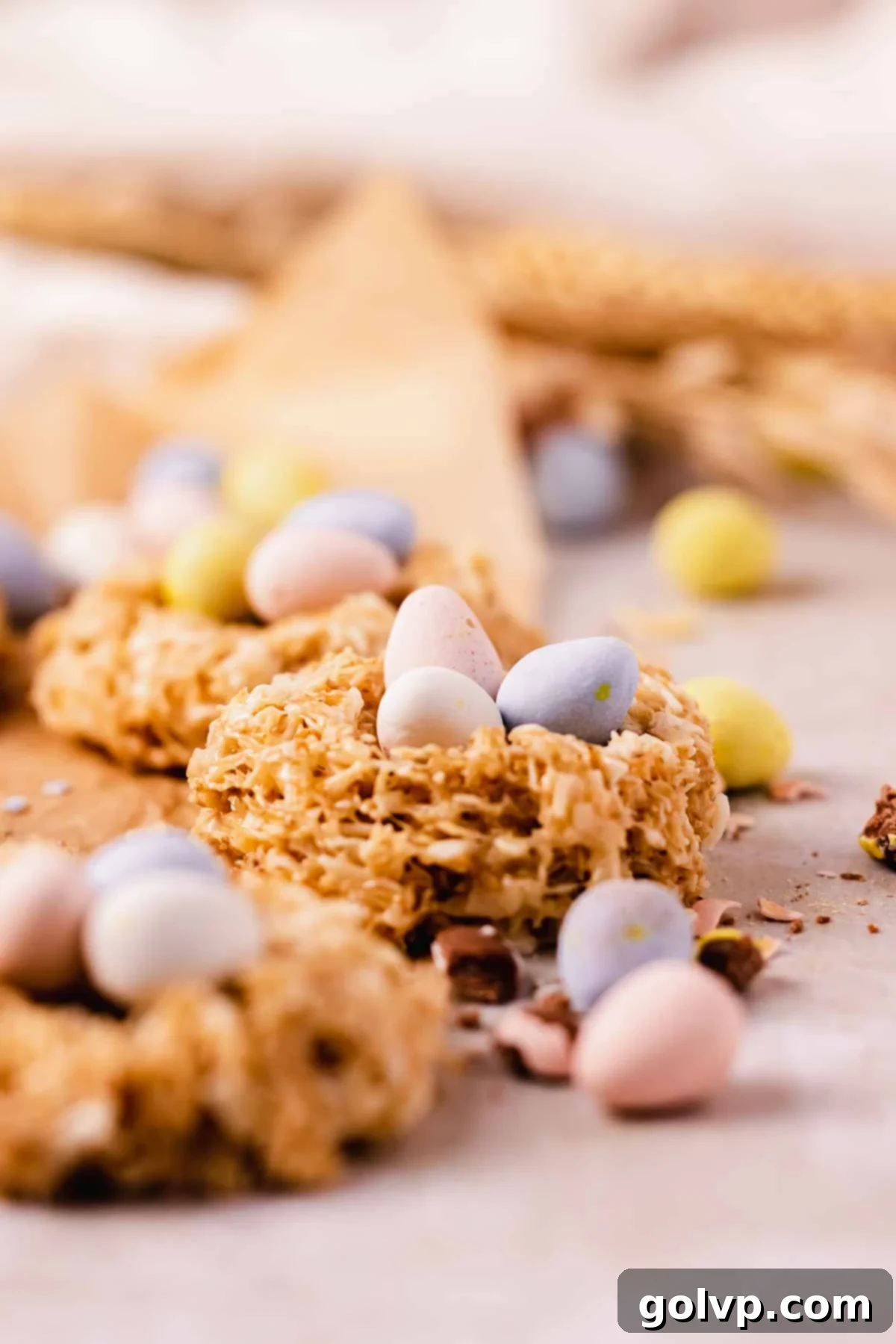 A no-bake cookie shaped into a bird's nest, filled with pastel candy-coated mini eggs