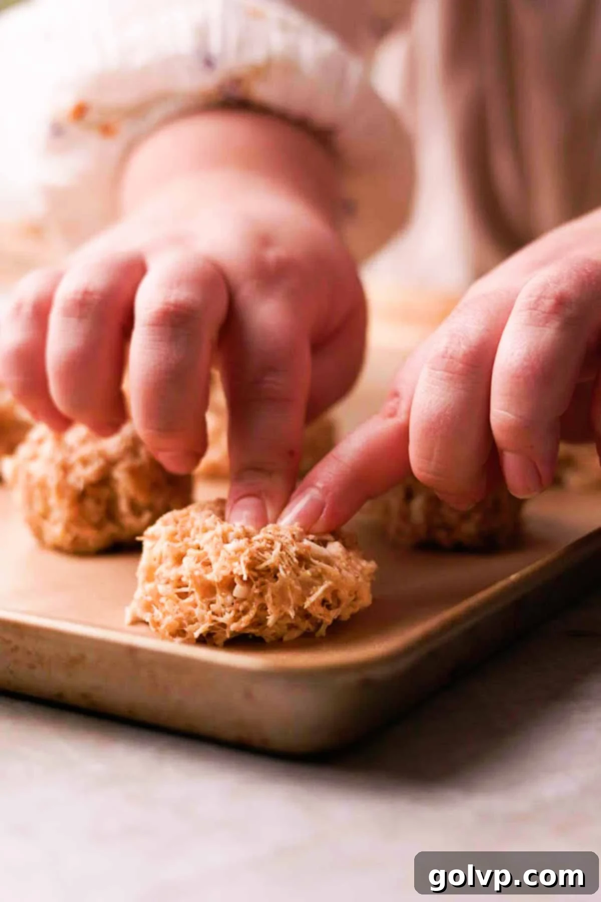 Shaping Birds Nest Cookies by hand on parchment paper