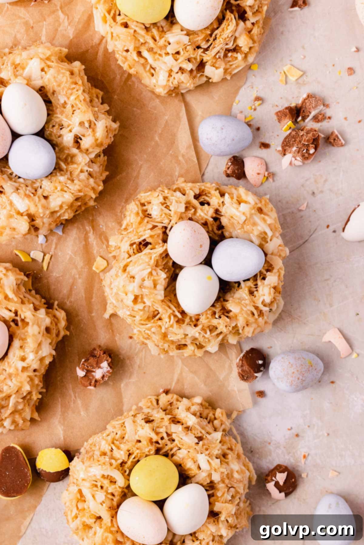 Nest cookies on parchment paper with toasted coconut and white chocolate