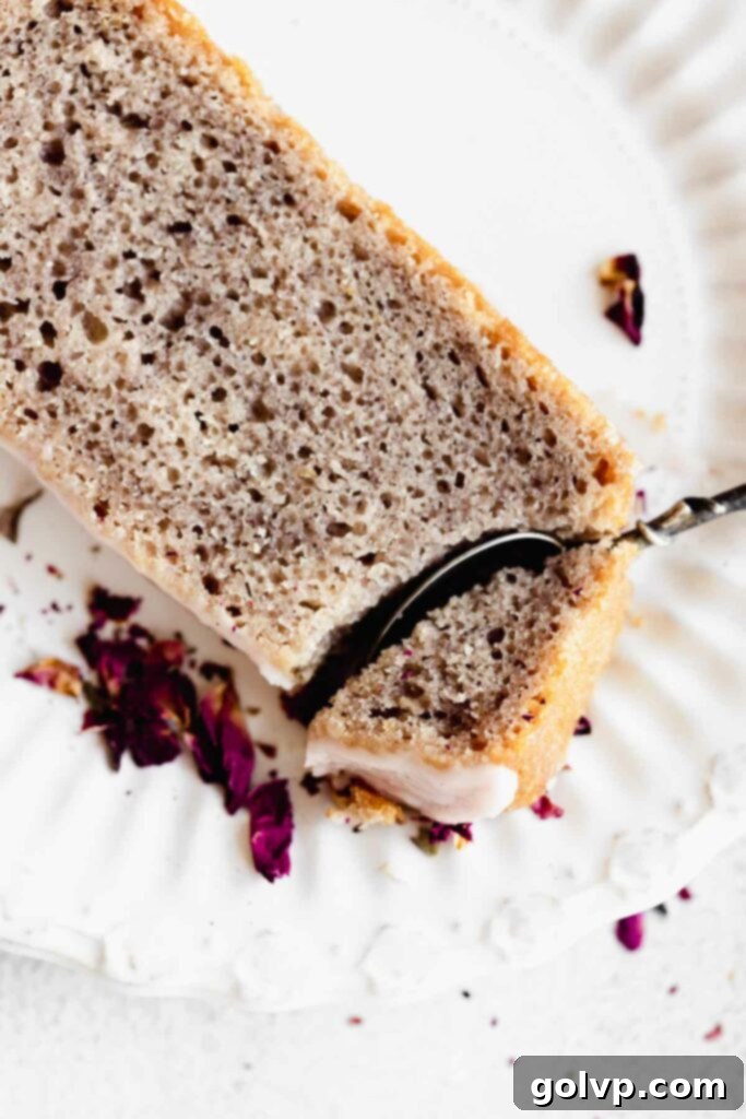 taking a bite of a slice of rose cake