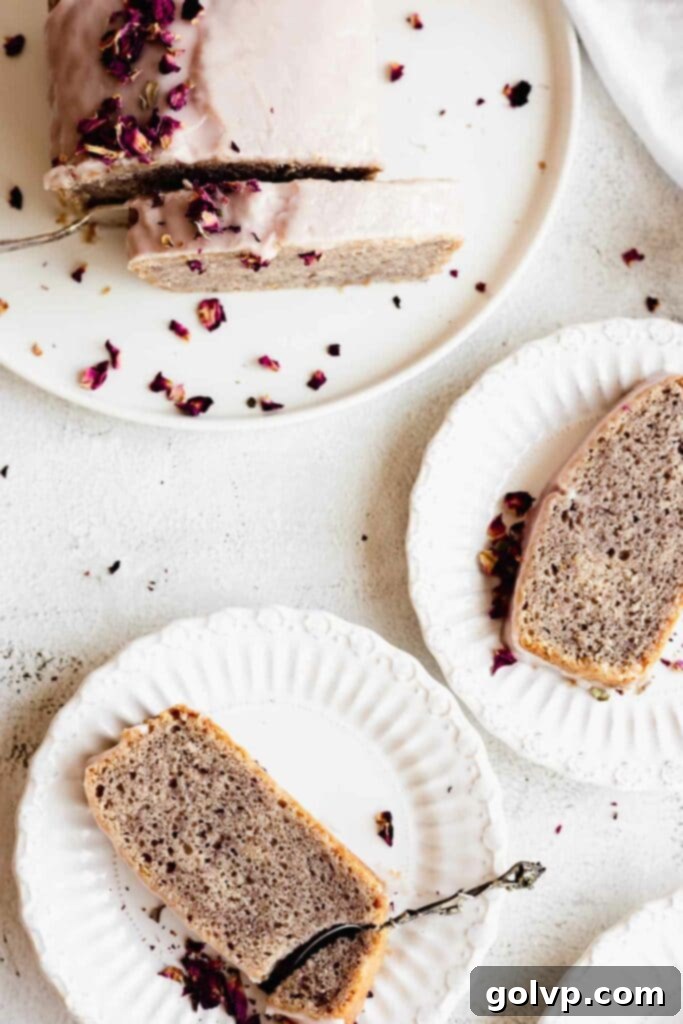 rose loaf cake slices on plates with scattered rose petals