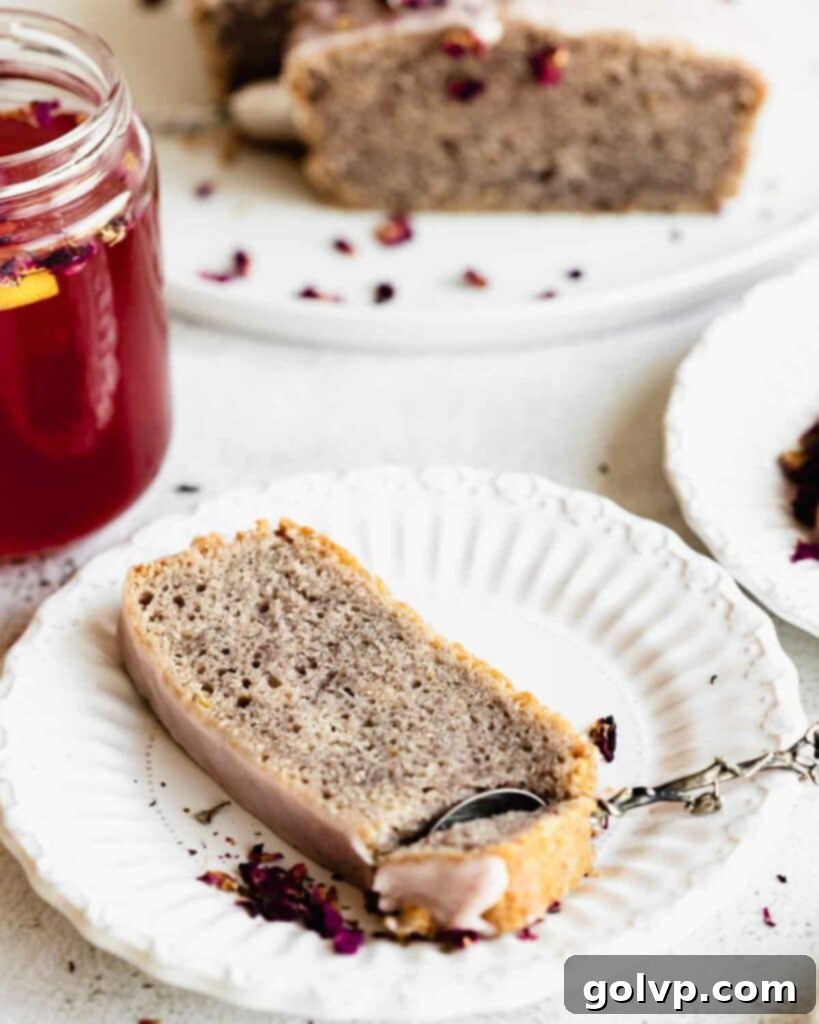 rose cake on a plate with a spoon