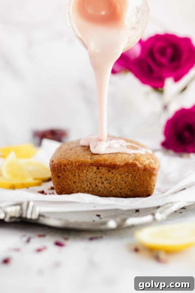 pouring the rose glaze over the baked loaf cake