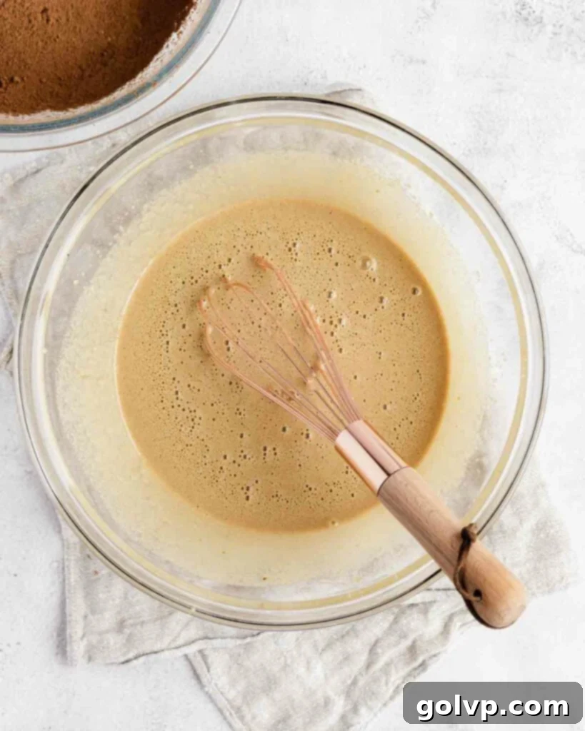 whisking eggs for the brownie layers