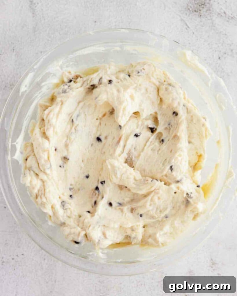 russian buttercream with chunks of cookie dough and chocolate chips, ready for assembly