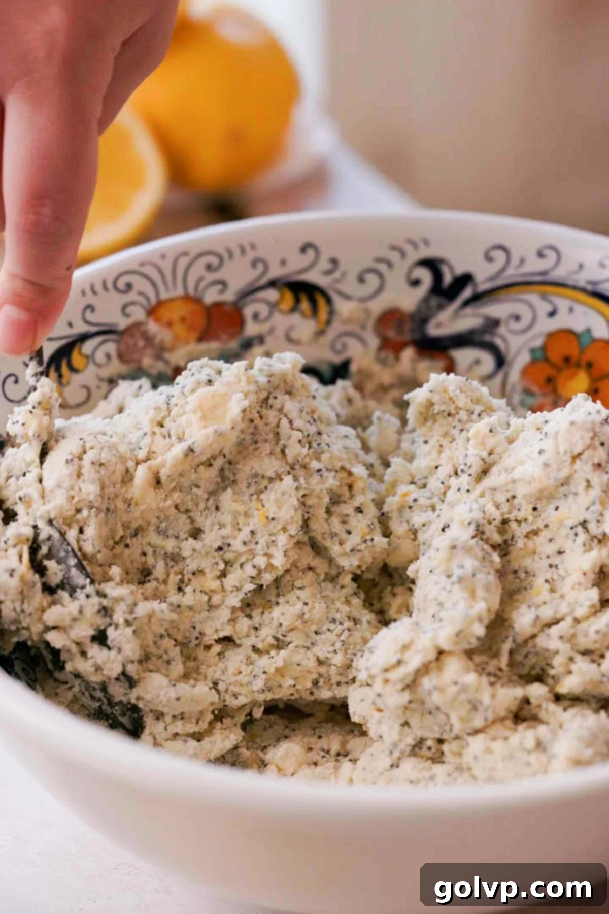 Stirring together the scone dough in a bowl with a spoon until it begins to clump