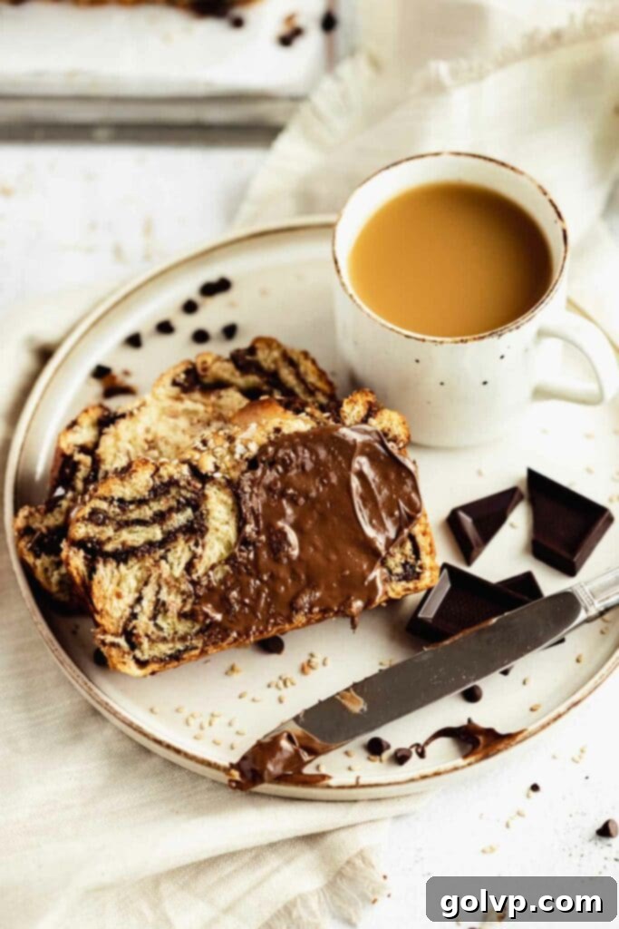 Easy No-Knead Chocolate Tahini Babka 4 Top view of chocolate babka with a rich chocolate spread visible on the surface