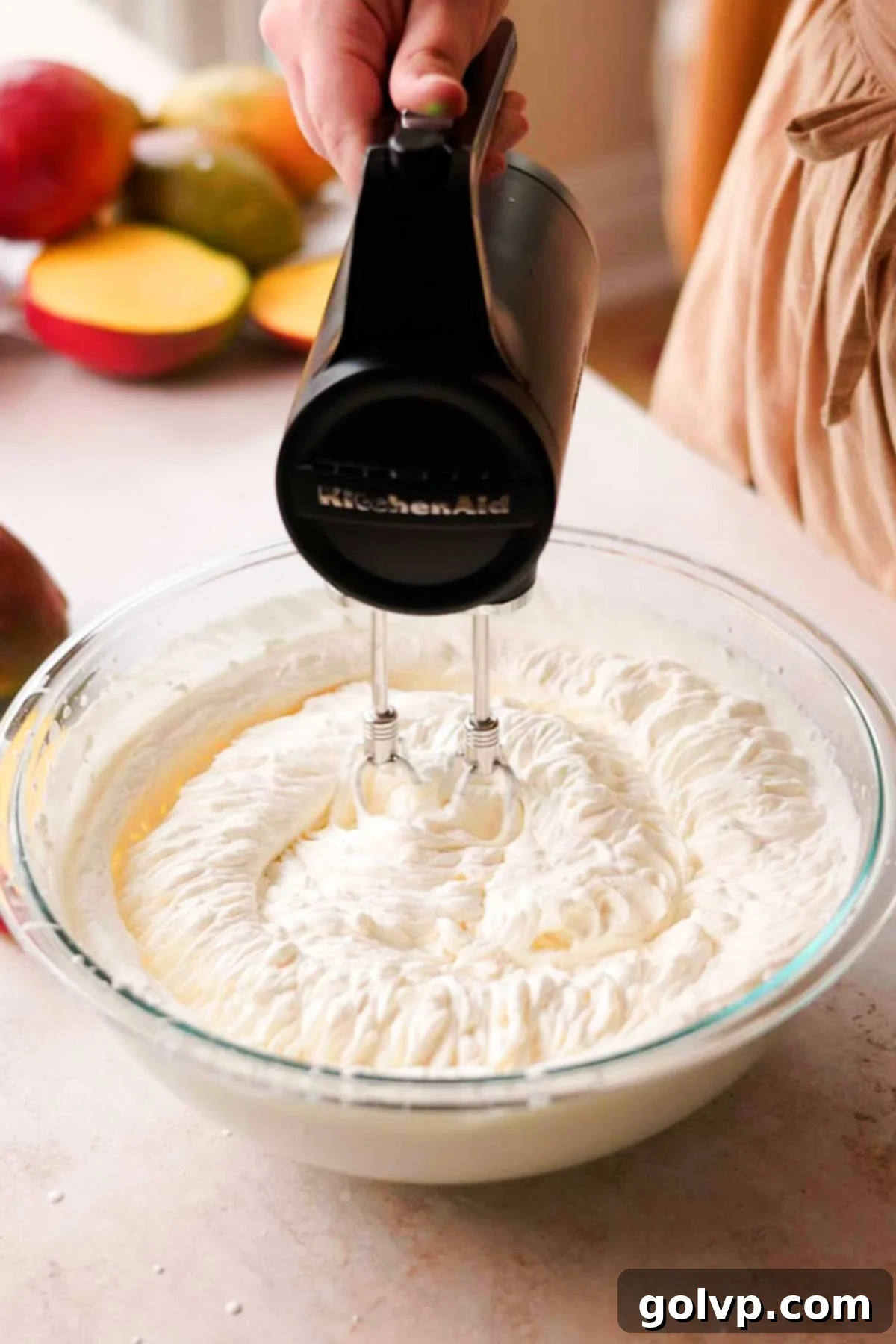 Decadent Mango Crepe Cake, Made Easy 12 Mixing whipped cream with softened mascarpone cheese and vanilla.