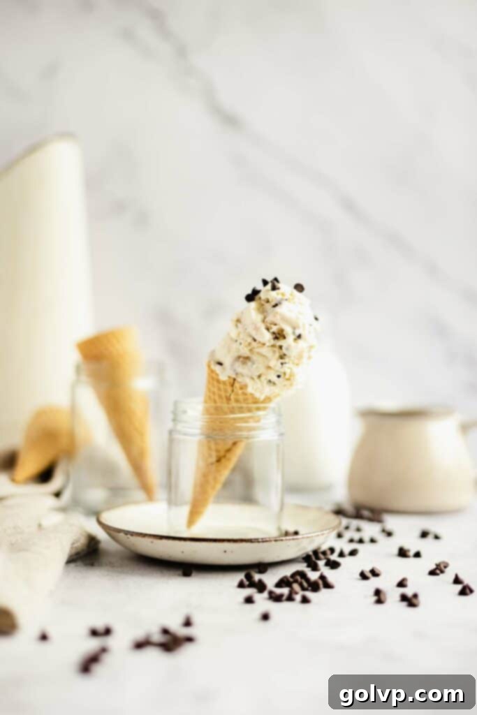 Scoop of Brown Butter Cookie Dough No-Churn Ice Cream in a bowl with cookie dough chunks