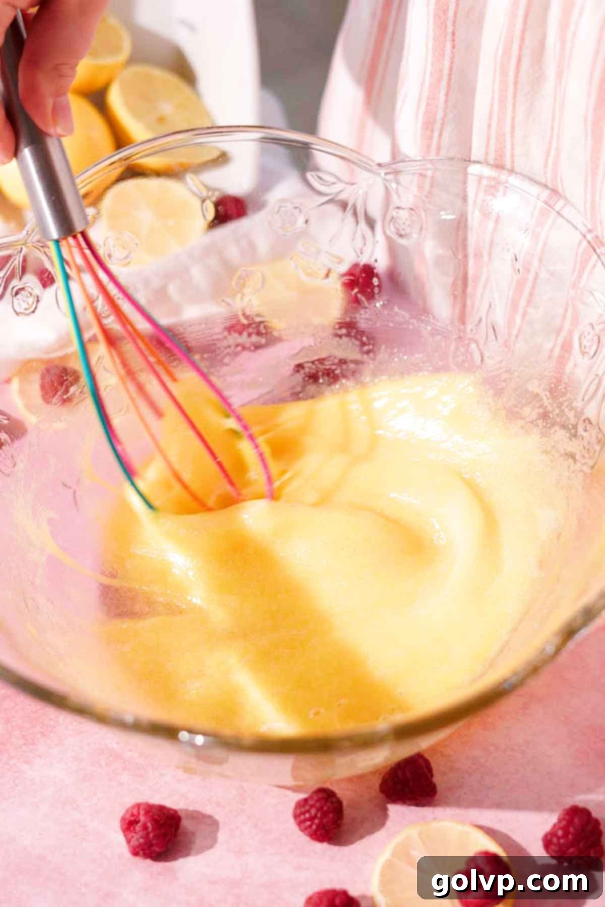 whisk eggs and sugar with silicone whisk in large glass bowl