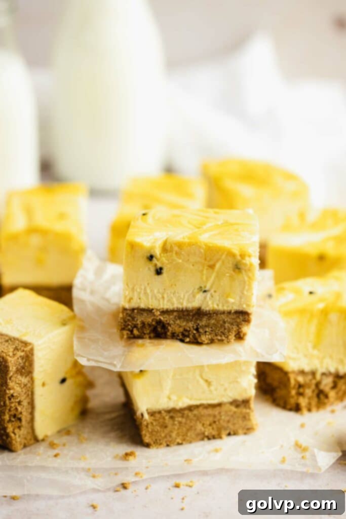 A close-up of a large slice of no-bake passion fruit cheesecake.