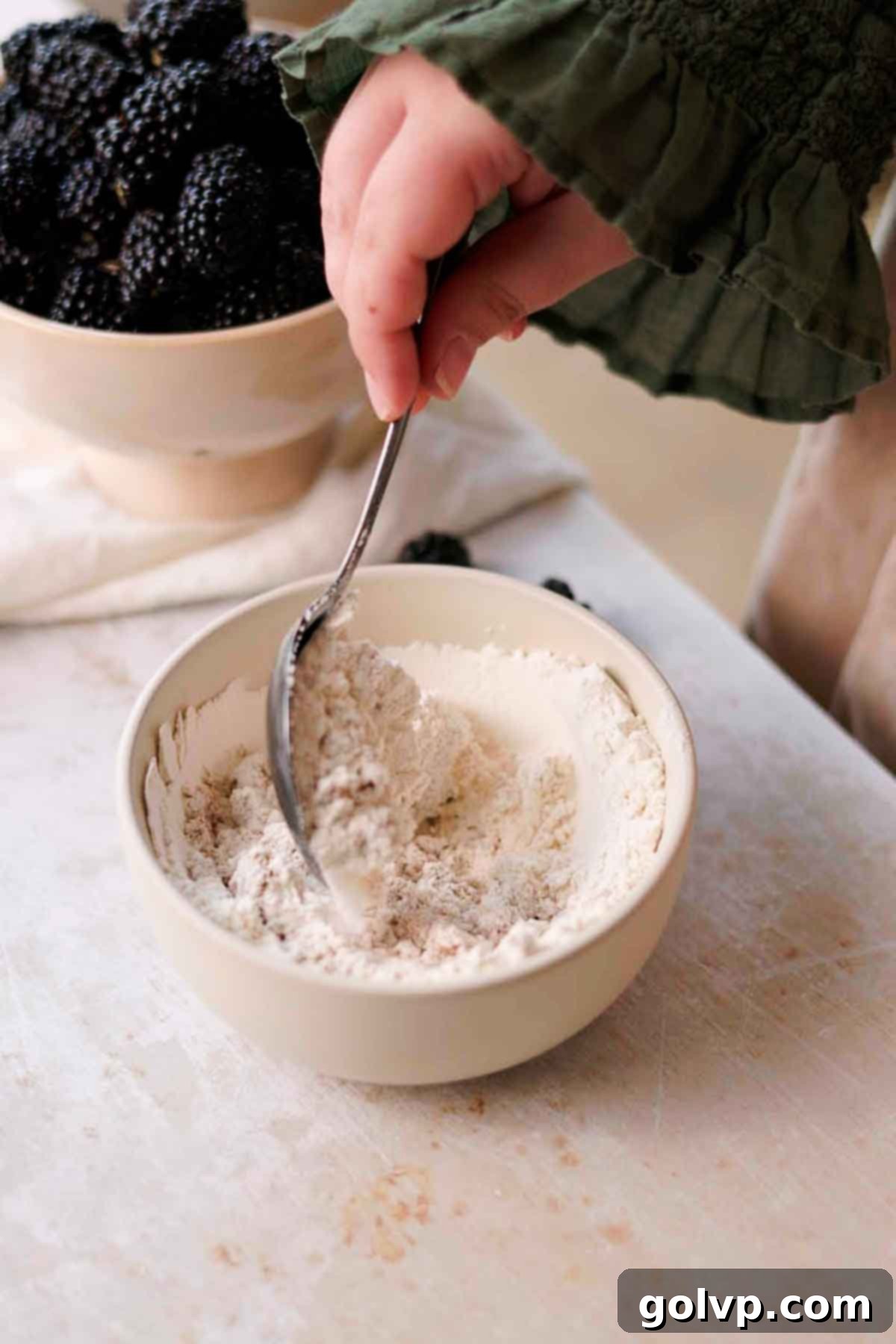 Mixing brown sugar, granulated sugar, flour, and salt together for the crumble topping.