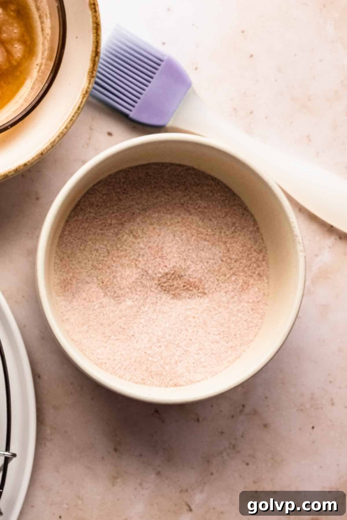 sugar and pumpkin spice in bowl on marble