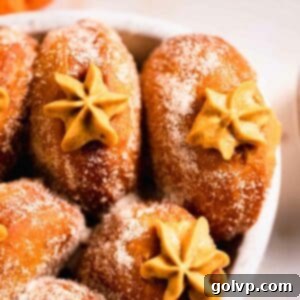 pumpkin donuts with piped filling peaking out in casserole dish