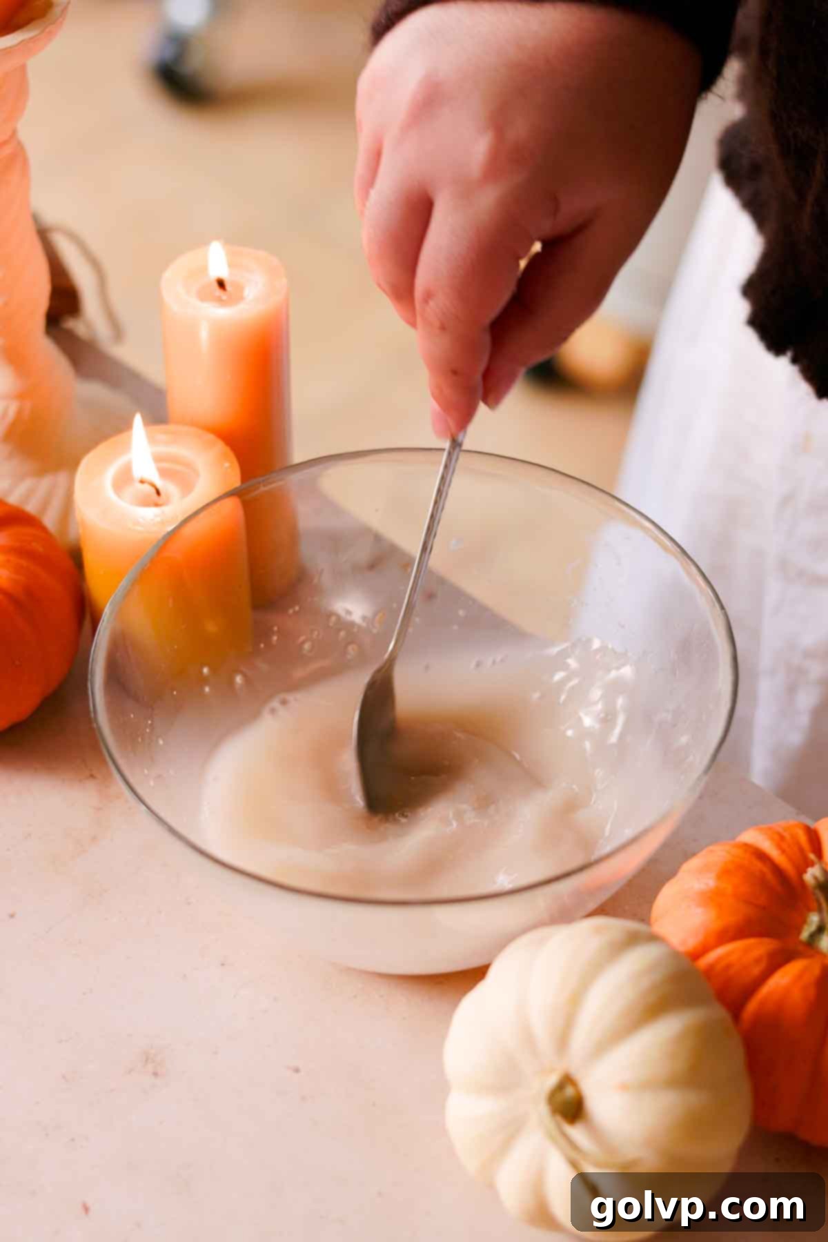 mixing yeast and water in a small glass bowl to dissolve with a spoon