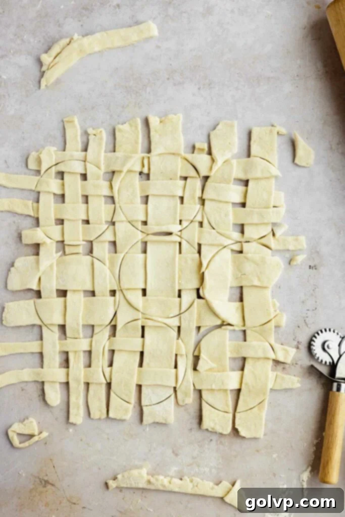 Cutting circles from the pre-woven lattice dough for mini pie tops.