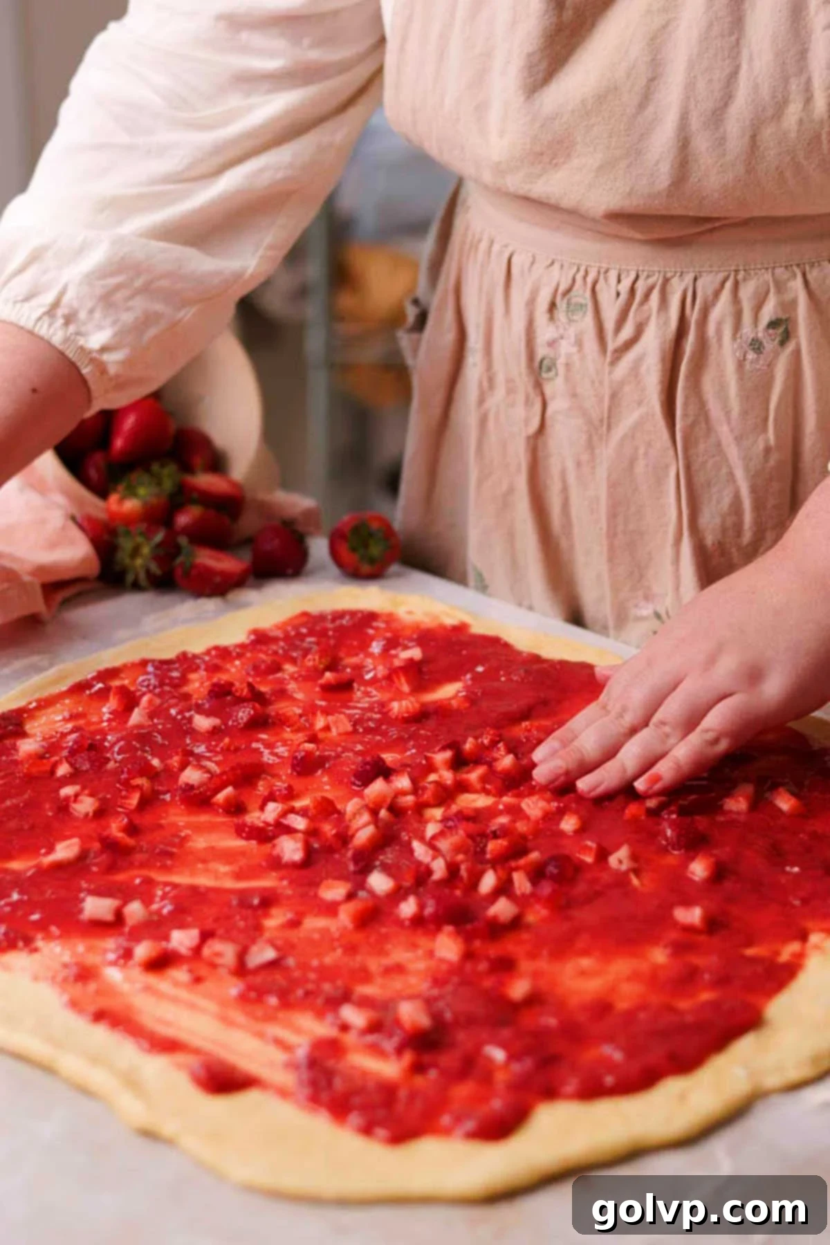 Fresh Strawberry Cinnamon Swirls 13 Rolled out dough generously spread with strawberry filling and topped with fresh chopped strawberries, leaving a border.