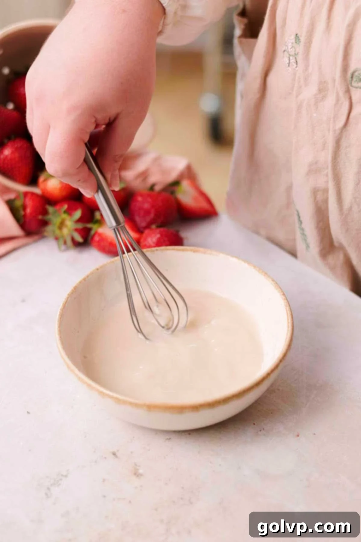 Fresh Strawberry Cinnamon Swirls 7 Whisking together warm water, sugar, and yeast in a medium bowl, showing the beginning of the yeast activation.