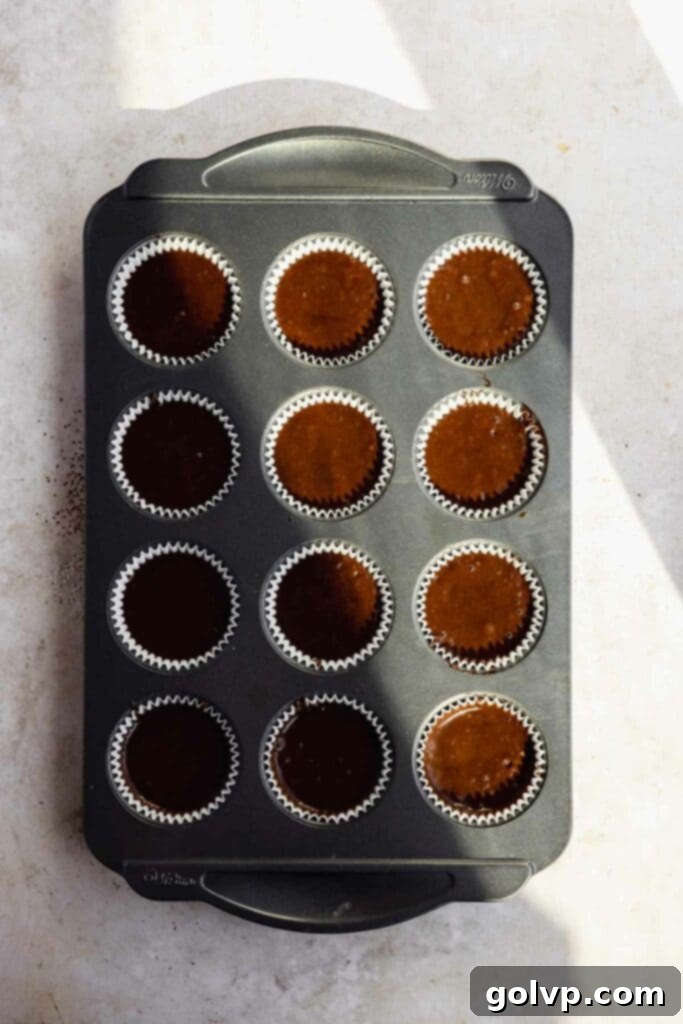 Decadent Black Forest Cupcakes 9 Raw chocolate batter neatly scooped into cupcake liners in a muffin tin