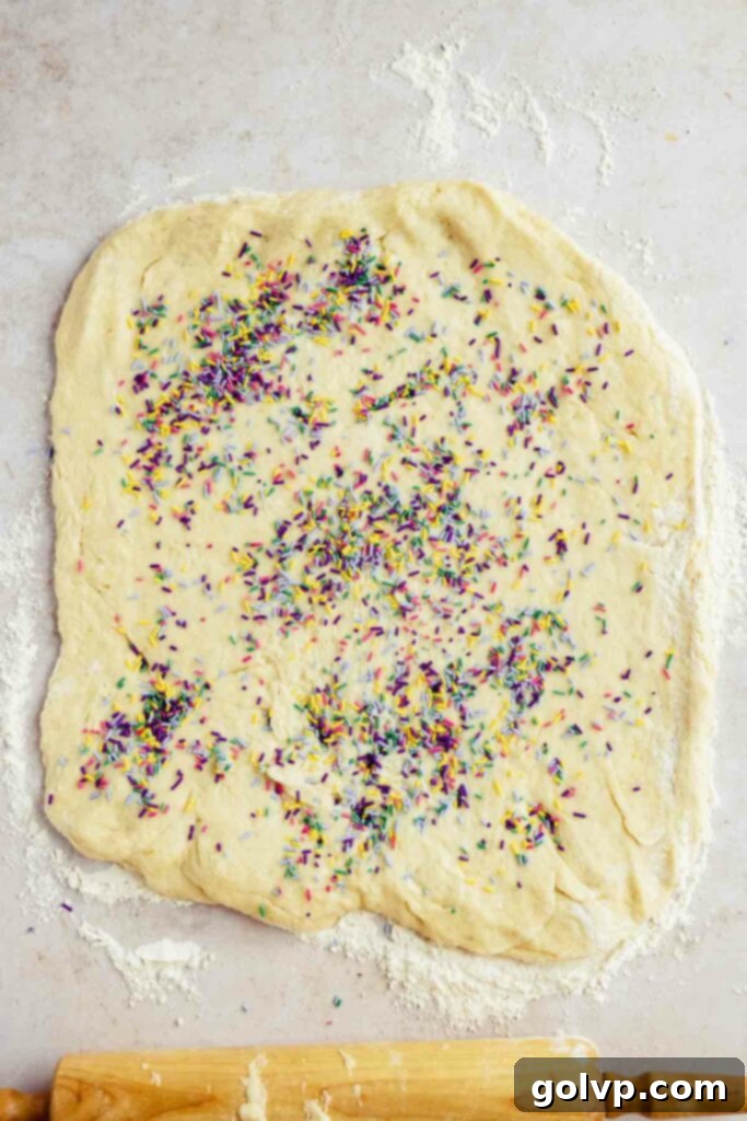adding the sprinkles into the dough