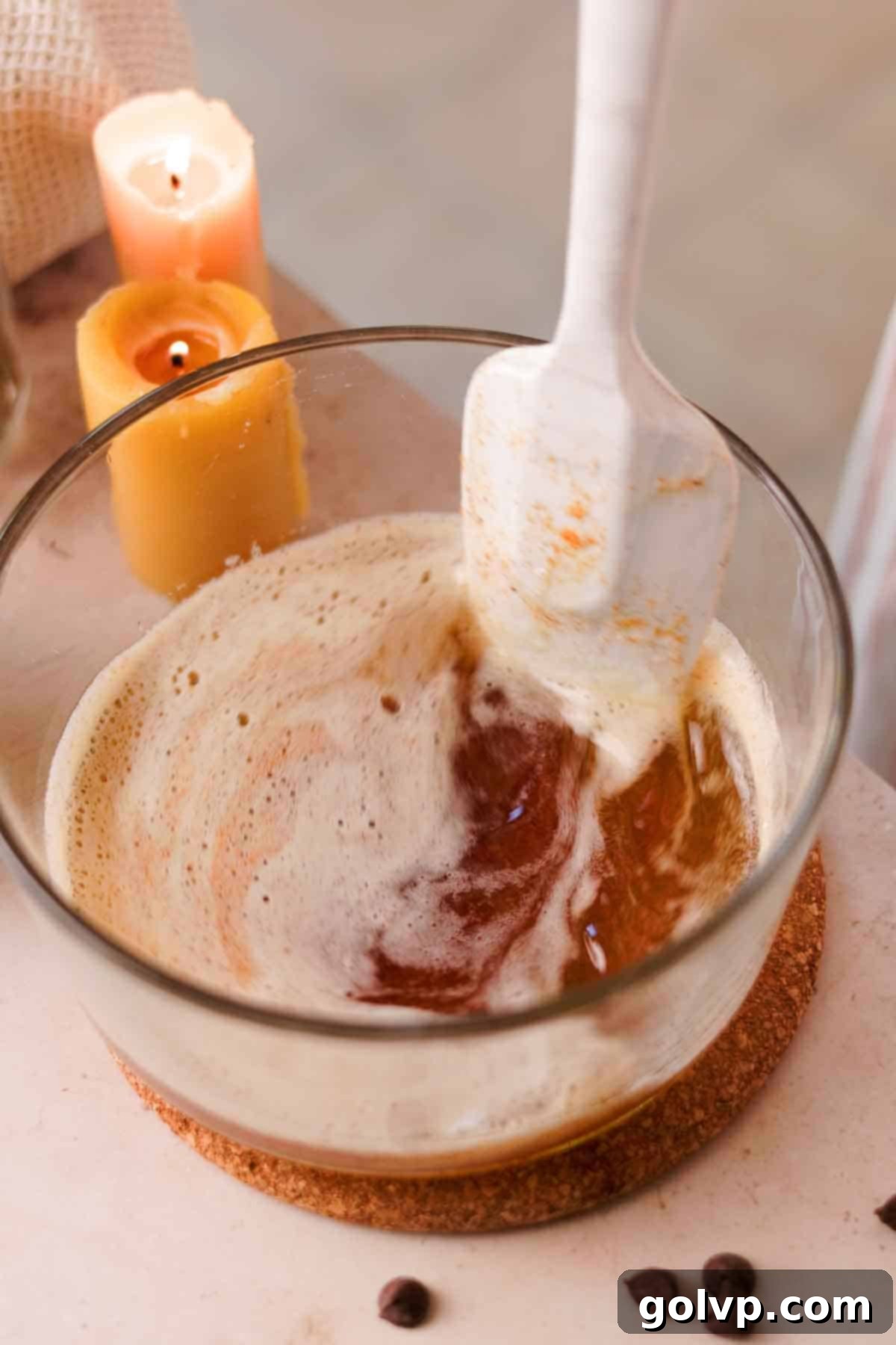 Heavenly Toffee Cookies: Our Foolproof Homemade Toffee Secret 11 stirring brown butter in glass container with silicone spatula