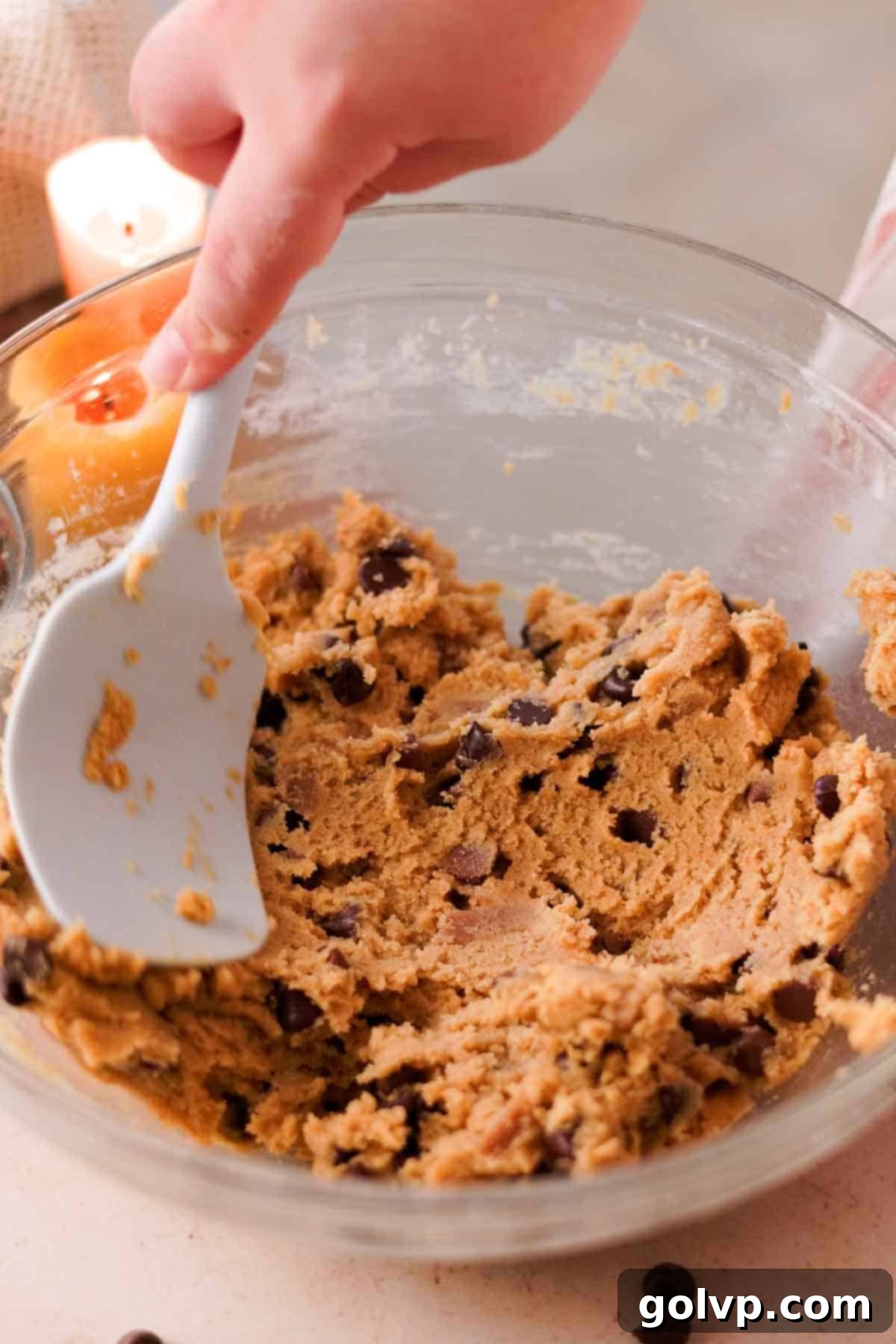 Heavenly Toffee Cookies: Our Foolproof Homemade Toffee Secret 16 stirring cookie dough in large bowl